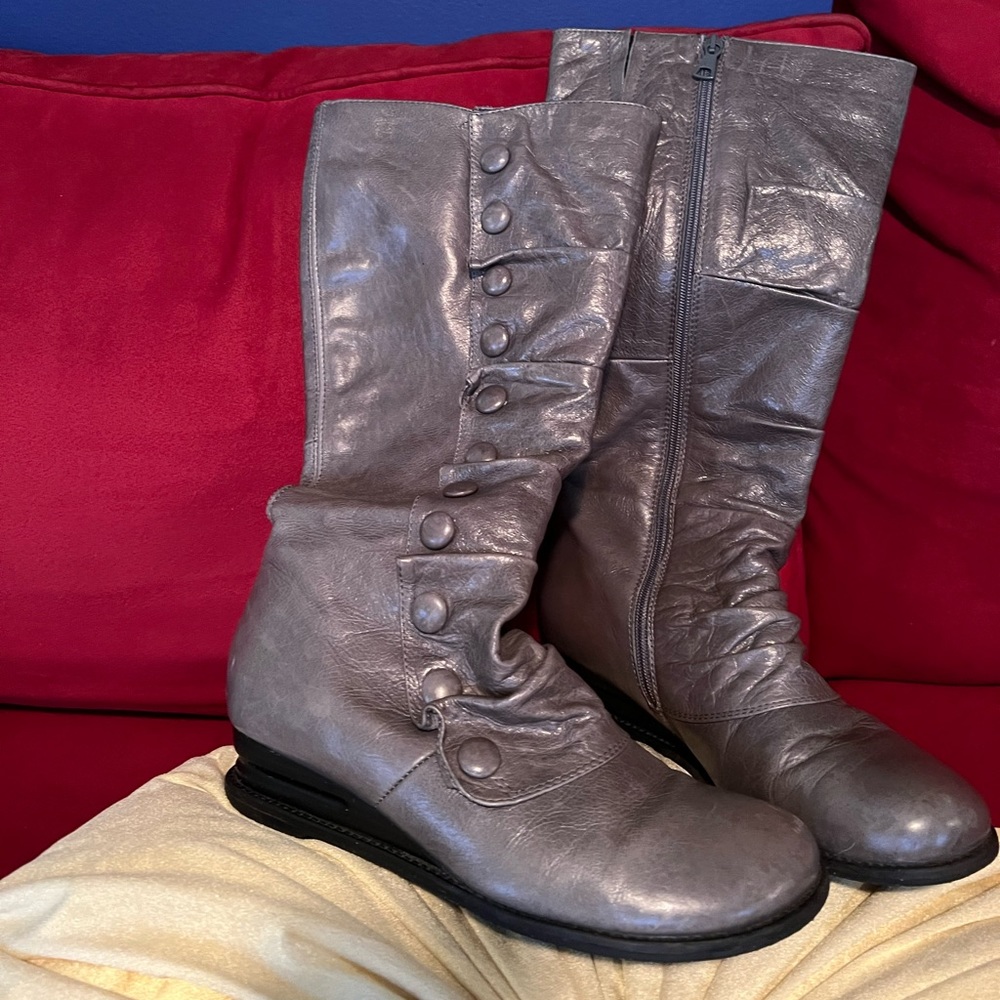 Knee height leather boots.